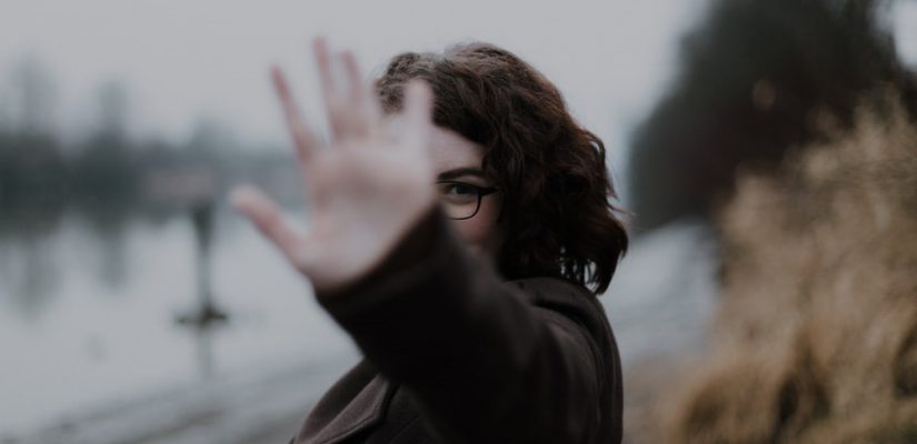Woman holding hand up