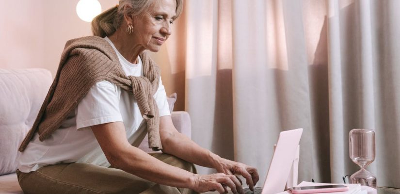 woman at table with laptop