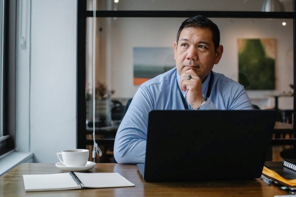 Man at desk with laptop