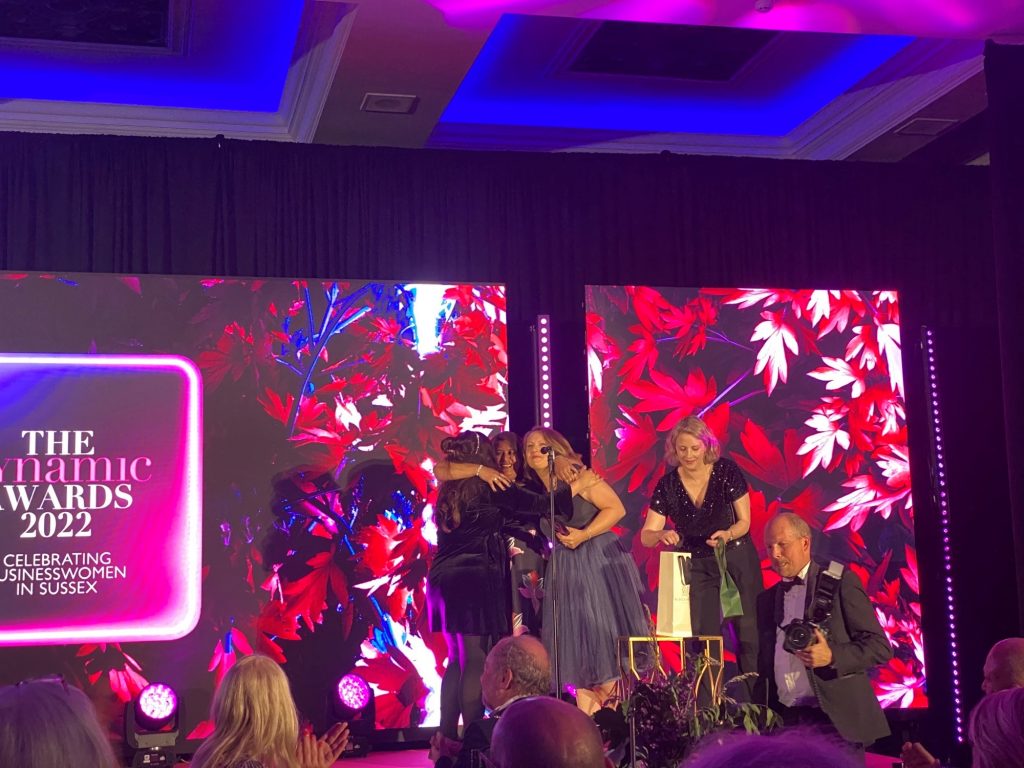 Rachel, Allegra and Mo on stage as they received the award from Joanne Simmons