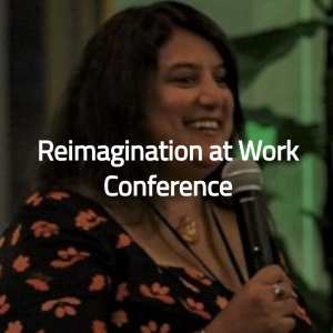 Reimagination At Work Conference photo of Mo with microphone